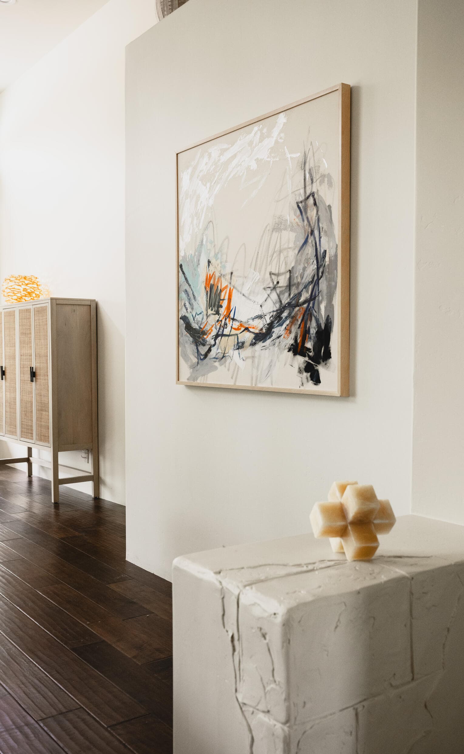 Entry with a large abstract painting above a console, in the Arizona Desert Retreat