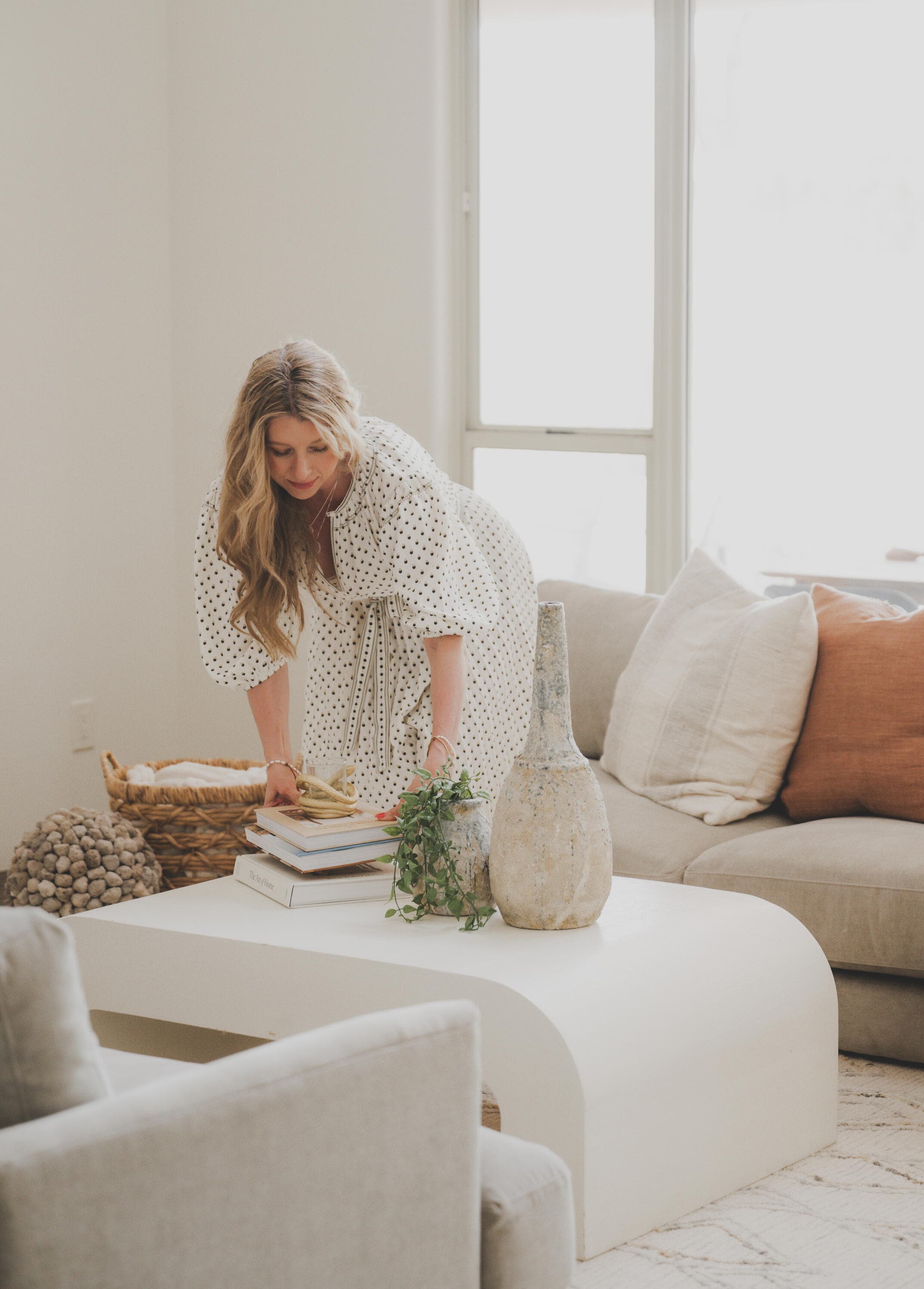 Wendy Lowell styling a living room with a woven wall hanging and linen sofa